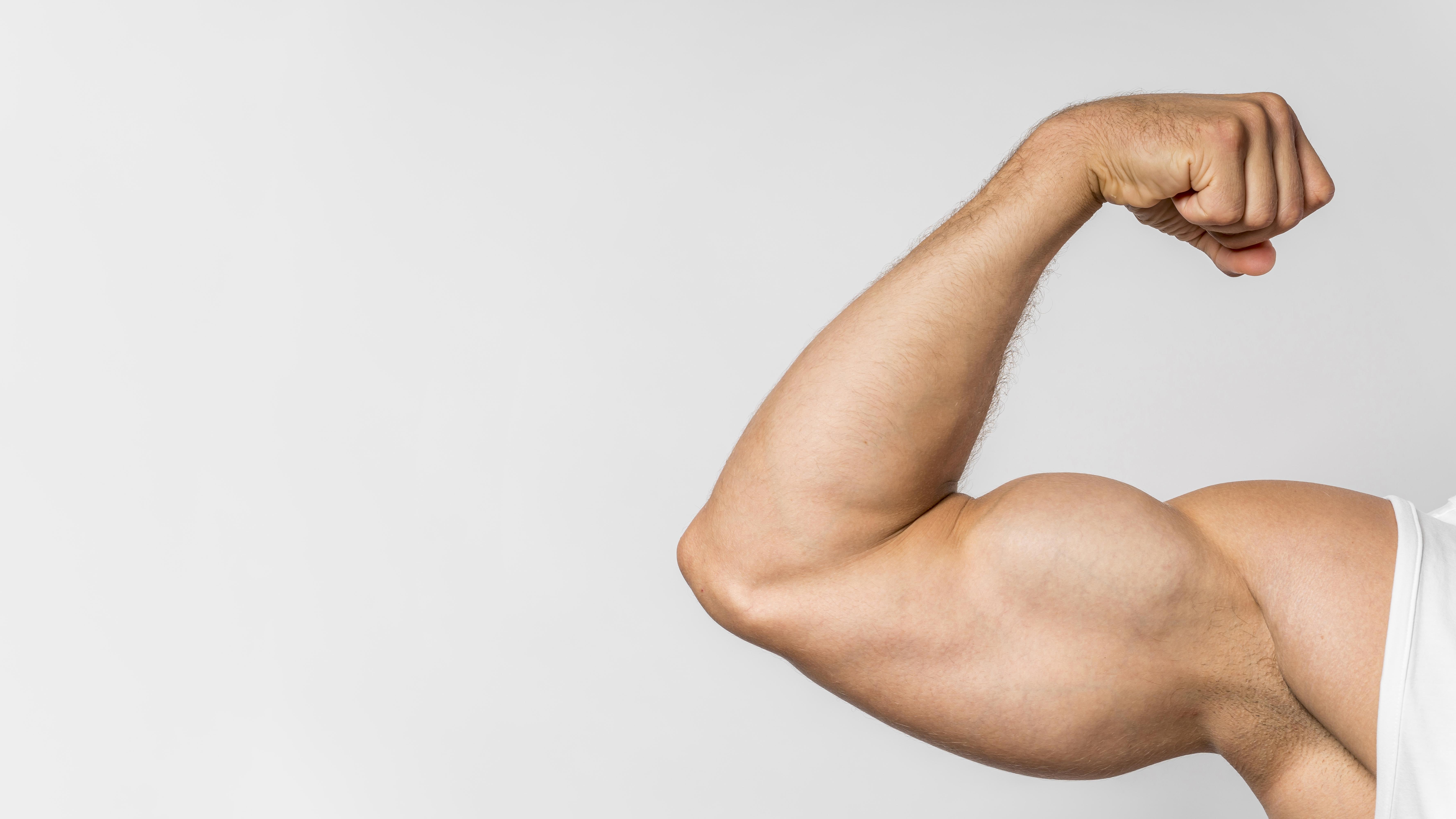Strong athlete lifting dumbbells